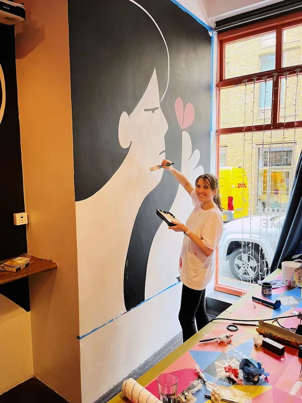 Murals, artist painting large mural
